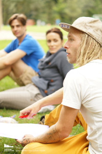 Participants discussing various topics related to slacklining in public spaces. Thanks to the beautiful weather, most of these conversations took place outdoors next to slacklines. 